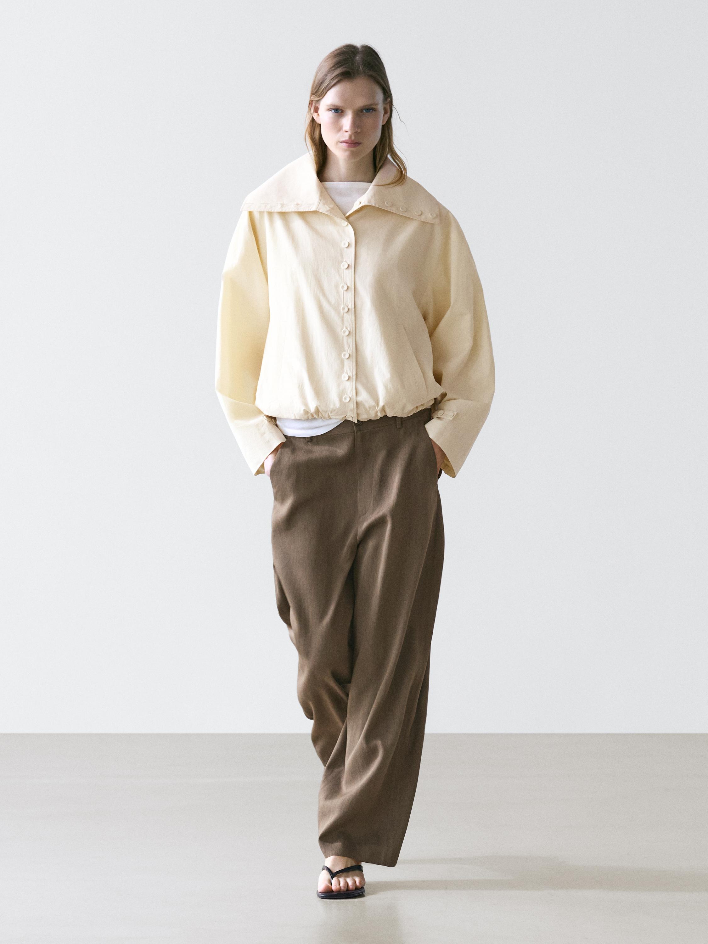 Flowing trousers with elasticated waistband